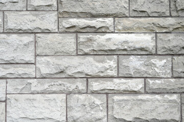 Textured Gray Stone Wall with Natural Variations and Patterns Ideal for Architectural Backgrounds and Construction Design Projects