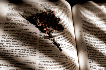 Medellin, Antioquia, Colombia. April 09, 2023. Wooden cross on the bible 