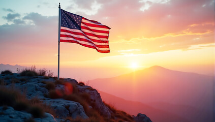 Obraz premium A dramatic view of an American flag waving on a mountain at sunrise, symbolizing strength and freedom on the 4th of July.