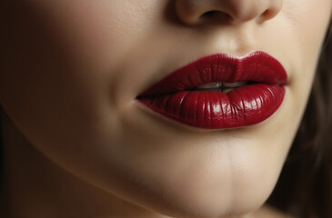 Fototapeta premium Close-Up of Glossy Red Lips with Subtle Details and Soft Lighting