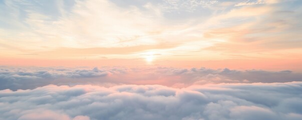 Fototapeta premium Serene sunset above fluffy clouds in pastel colors.