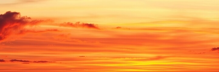 Obraz premium Sunset sky with deep orange and purple hues bleeding into each other on a soft watercolor background featuring gentle wisps of clouds, sky, abstract