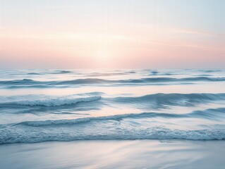 Obraz premium Serene ocean waves at sunset with soft colors.