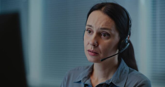 Modern call center office of psychological helpline: Portrait of Caucasian female hotline operator talking on headset, consulting person online, providing mental health help. Emotional support concept