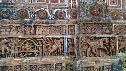 Popular terracotta art portraying hindu mythological stories on Kantajew temple in Bangladesh.Commonly known as Kantaji Temple,is a late-medieval Hindu temple.
