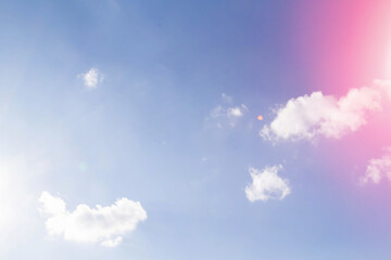 White airy beautiful clouds in a bright blue sky. Clear sunny weather. The concept of environmental safety and cleanliness..