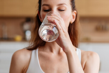 Closeup of a woman drinking water for hydration, thirst and health wellness, diet and healthy lifestyle