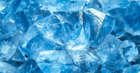 Blue Crystal Mineral Stone. Gems. Mineral crystals in the natural environment. Texture of precious and semiprecious stones. Seamless background with copy space colored shiny surface of precious stones