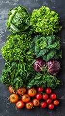 A vibrant display of various leafy greens and ripe tomatoes against a dark, textured background. Perfect for illustrating healthy eating, organic produce, or vegetarian lifestyle concepts