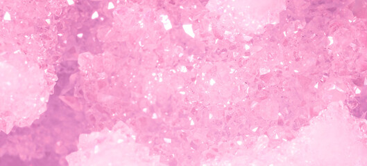 Amethyst pink crystals. Gems. Mineral crystals in the natural environment. Texture of precious and semiprecious stones. Seamless background with copy space colored shiny surface of precious stones.