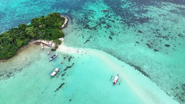 Aerial drone shot of the snake islands in the phillipines. Orbit shot in palawan