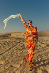 A girl poses on the dunes in the 