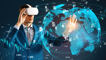 Businessman with VR headset interacting with global currency symbols and data charts in digital space.