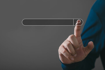 A hand interacts with a digital search bar, symbolizing online exploration and information...