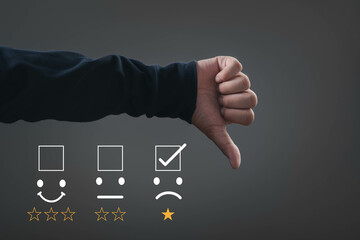 A hand showing a thumbs down gesture represents disappointment. Visual metaphor for negative feedback or poor ratings.
