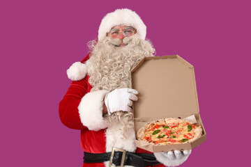 Santa Claus with box of tasty pizza on purple background