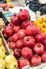 fresh fruit food pomegranate ripe red background healthy market organic vegetarian juicy closeup