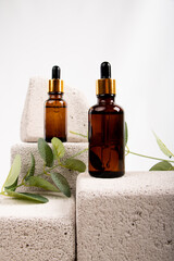 Amber Dropper Bottle on Textured Stone with Greenery for Natural Skincare and Wellness