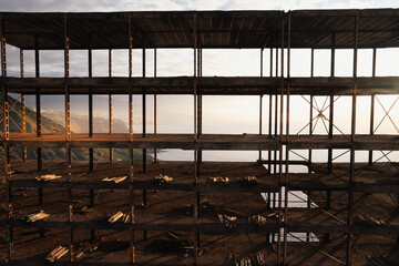 An abandoned construction site on top of a cliff