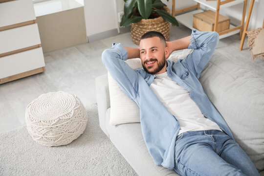 Young man resting on his day off at home
