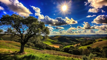 Fototapeta premium A picturesque vista of rolling green hills under a brilliant blue sky adorned with puffy white clouds, the sun radiating its warm glow