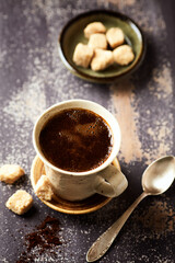Mug of coffee on rustic wooden background. Copy space.