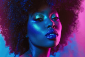 portrait of young charming african girl in pink neon light at black background