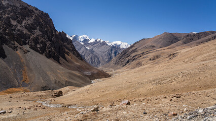 Scenic landscape view along the Karakoram Highway of snowcapped Karakoram mountain range in Khunjerab National Park, Hunza Nagar, Gilgit-Baltistan, Pakistan