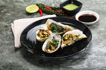 Open half oysters with green onion