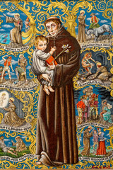 Obraz premium Painting of Saint Anthony of Padua or Saint Antoine de Padoue holding baby Jesus Christ in her arms. ...