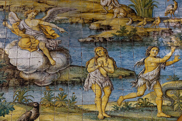 Mosaic of Adam and Eve expelled from paradise. ...