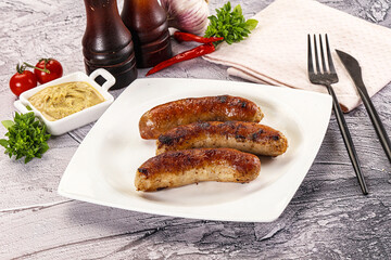 Delicous natural roasted sausages in the plate