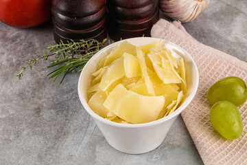 Parmesan cheese slices in the bowl