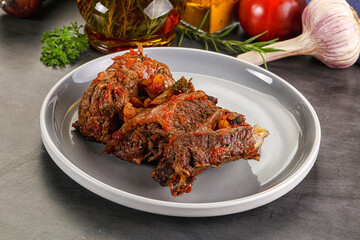 Baked beef ribs with vegetables