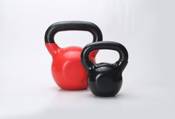 colorful kettlebell weights isolated on light background