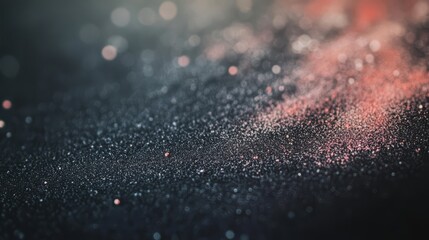 Abstract bokeh background with glowing particles and soft light.