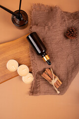 Aromatherapy Dropper Bottles with Candles and Dried Flowers for Relaxing Spa Atmosphere