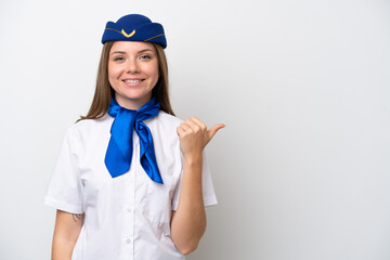 Airplane Lithuanian woman stewardess isolated on white background pointing to the side to present a product