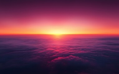 Obraz premium A breathtaking aerial view of a vibrant sunset over the clouds, showcasing a gradient of pink and purple hues blending seamlessly into the horizon.