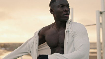 An athlete wears a hoodie after an outdoor workout, the end of workout, good job