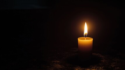 Flickering Candle in Dark Setting