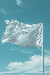 White flag is flying in the sky on a cloudy day. The flag is blowing in the wind, and the sky is blue with some clouds. Scene is calm and peaceful, as the flag is a symbol of freedom