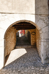 Obraz premium A road between the old houses of Sepino, a village in Molise, Italy.