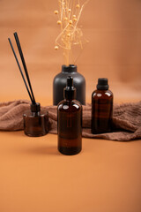 Amber Glass Bottles with Diffuser and Dried Flowers for Natural Skincare and Aromatherapy Display