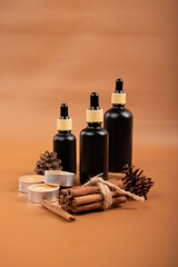 Amber Glass Bottles with Cinnamon and Tealight Candles for Aromatherapy and Spa Decor