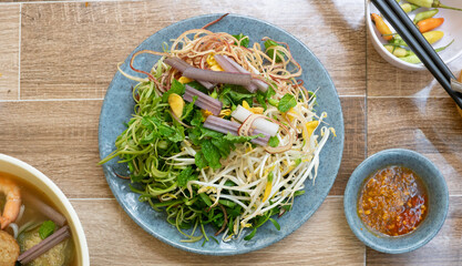 Raw vegetables served with dishes. Fresh herbs ( bitter knotgras, bean sprout, chives, banana blossom, yellow velvetleaf, water mimosa, morning glory, Mint Leave, lotus root salad )