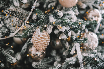 Decorative Christmas tree adorned with ornaments and lights during winter season