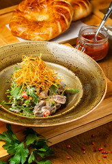 Salad with mushrooms, beautifully served in a cafe, restaurant, rustic.