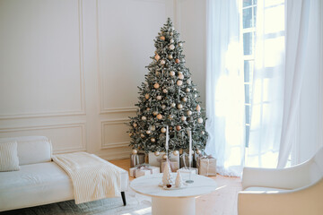 Beautifully decorated Christmas tree in a bright, modern living room setting