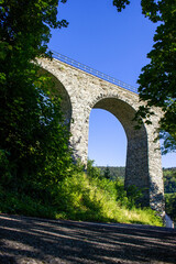 Fototapeta premium A historic railway viaduct located in a forest in the Czech Republic